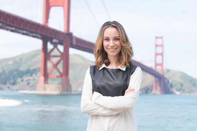 Standing under the San Francisco Bay Bridge as a successful investor. 